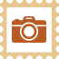 Postage stamp with a camera icon - orange
